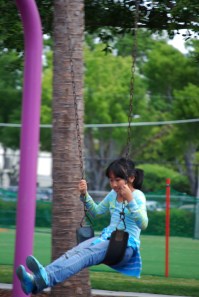 Park girl on swing for class