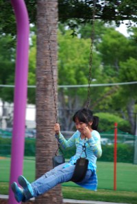 Park girl on swing for class